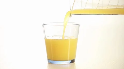 Pouring orange juice into the glass  Stock Footage 8564121