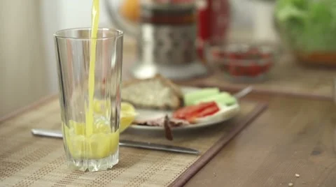 Pouring orange juice in glass, slow motion shot at 240fps HD Stock Footage