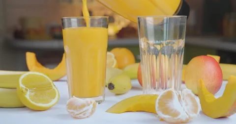 Pouring Organic Freshly Squeezed Fruit smoothie Into the Glass Stock Footage 166390648
