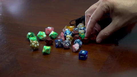 Pouring out dice and selecting Stock Footage