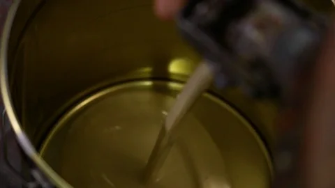 Pouring paint in a can, empty Stock Footage 78426831