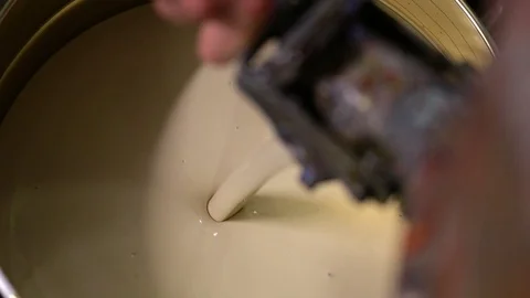 Pouring paint in a can, focus Video stock 78426919