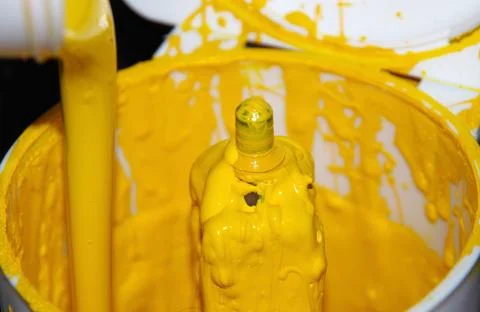Pouring the paint Stock Photos