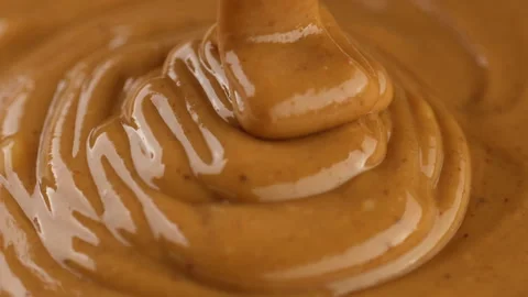 Pouring peanut butter, close up 스톡 동영상 252564025