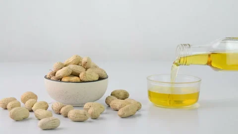 Pouring peanut oil Stock Footage 166036982