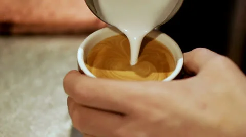 Pouring a perfect rosetta Stock Footage 22921406