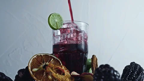 Pouring Peruvian Chicha Morada into a glass Stock Footage 342993500