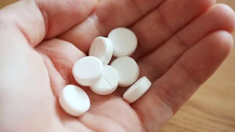 Pouring pills on palm Stock Footage 81329935