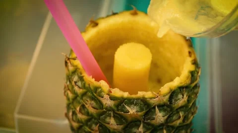 Pouring a pineapple cocktail - Slow Motion Stock Footage 66836673