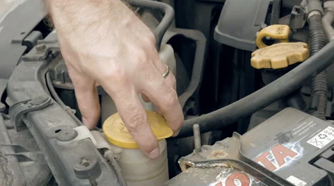 Pouring pink windshield washer fluid into the car 스톡 동영상 63624694