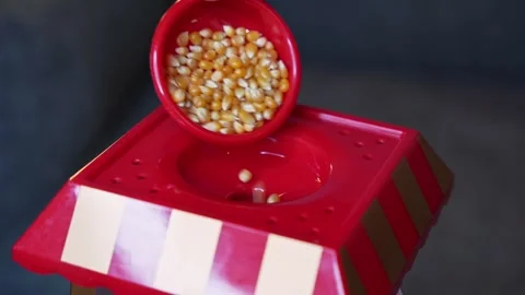 Pouring Popcorn Kernels Into Vintage Machine Stock Footage 335186325