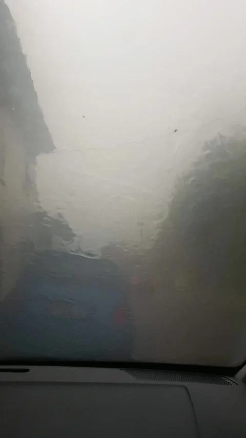 Pouring rain on the car window Stock Footage 315227033