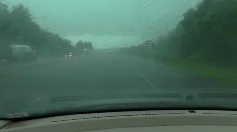 Pouring Rain on Car Windshield While Driving Video stock 27466643