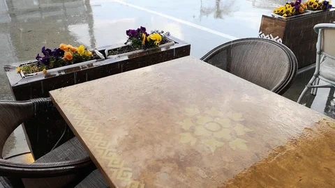 Pouring rain in open cafe on the seashore 動画素材 107564330