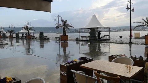 Pouring rain in open cafe on the seashore 動画素材 107620809