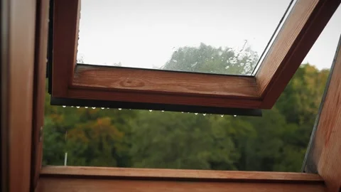 Pouring rain outside open window. Raindrops dripping from open wood window Stock Footage 210181525
