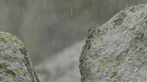 Pouring rain , water drops falling on rocks Stock Footage 142579926