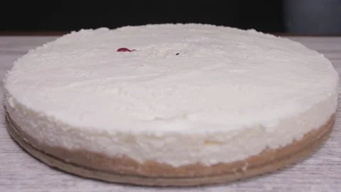 Pouring raspberry sauce on top of berry pie Stock Footage 150458190