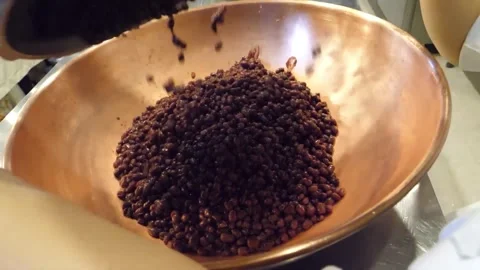 Pouring Raw Adzuki Beans into a Copper Mixing Bowl Stock Footage 345291328