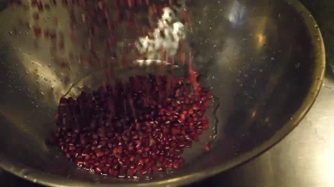 Pouring Raw Red Adzuki Beans Into a Metal Mixing Bowl Stock Footage 345293675