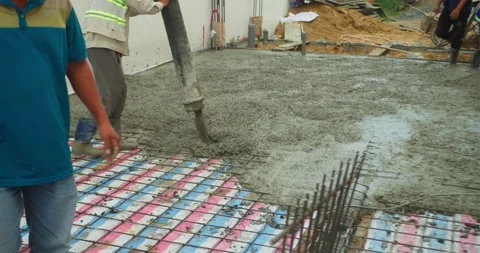 Pouring ready-mixed concrete after installing steel reinforcement to create a 動画素材 306232048