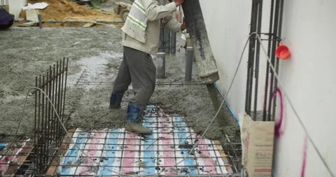 Pouring ready-mixed concrete after installing steel reinforcement to create a 動画素材 306232063