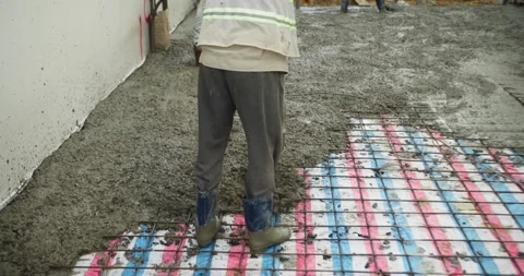 Pouring ready-mixed concrete after installing steel reinforcement to create a 動画素材 306232067