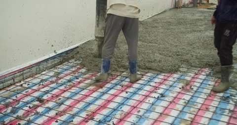 Pouring ready-mixed concrete after installing steel reinforcement to create a 動画素材 306556821