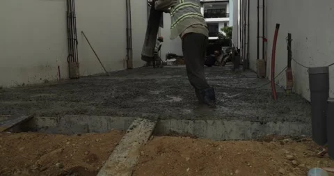 Pouring ready-mixed concrete after installing steel reinforcement to create a 動画素材 307236743