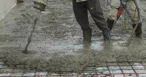 Pouring ready-mixed concrete after installing steel reinforcement to create a 動画素材 308101461