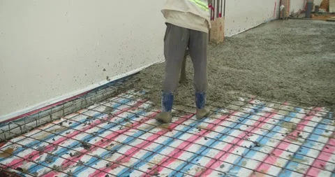Pouring ready-mixed concrete after installing steel reinforcement to create a 動画素材 309114341