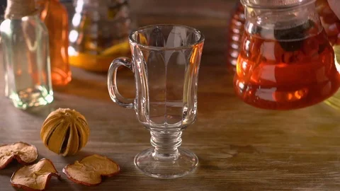 Pouring red fruit and berry tea in slow motion Stock Footage 69780471