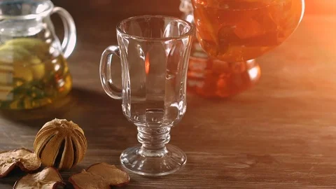 Pouring red fruit and herbal tea in slow motion Stock Footage 69780088