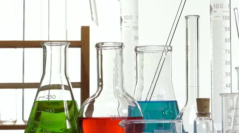 Pouring red liquid using a funnel Video stock 64290545