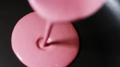 Pouring red pancake batter in a pan for cooking pancakes. Process of preparing Stock Footage 144904754