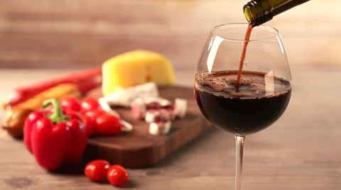 Pouring red wine and snacks Stock Footage 35222347