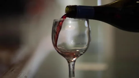 Pouring red wine at a bar in slow motion. Stock Footage 147968077