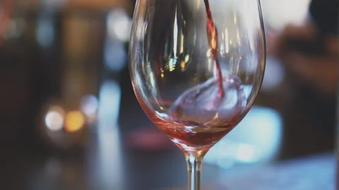 Pouring red wine from bottle into glass. Wine degustation. Stock Footage 88587728