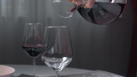 Pouring red wine from the count into a cup of slow motion 스톡 동영상 103146422