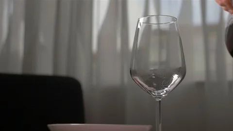 Pouring red wine from the count into a cup of slow motion Stock Footage 103147926