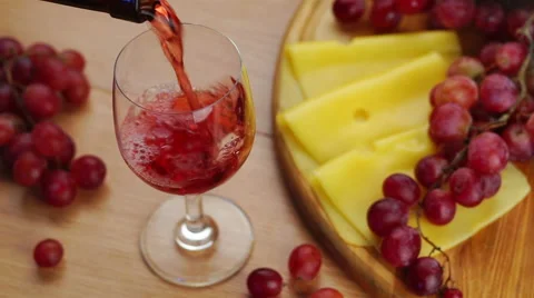 Pouring Red Wine Into Glass. Stockbeeldmateriaal 68415871