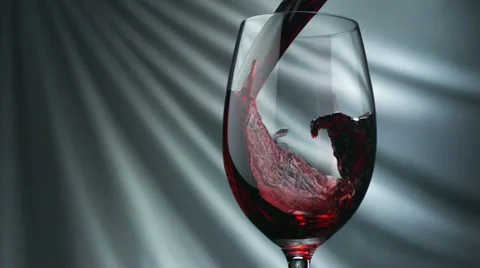 Pouring red wine into glass, Slow Motion Stock Footage
