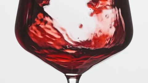 Pouring red wine into goblet. Close-up of filling wine glass with red wine Video stock 116601109