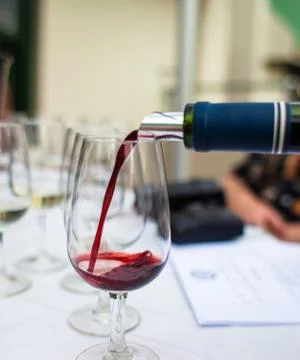 Pouring red wine Stock Photos