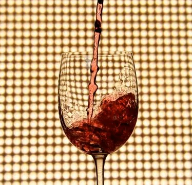 Pouring red wine Stock Photos