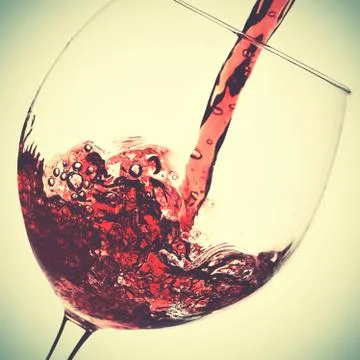 Pouring of red wine Stock Photos