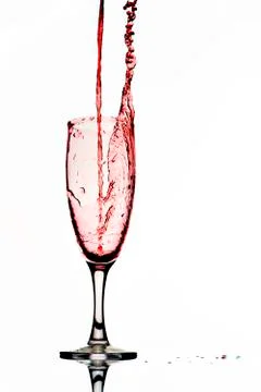 Pouring red wine. Stock Photos