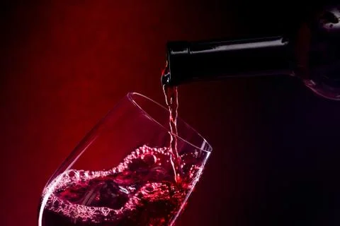 Pouring red wine Stock Photos