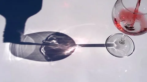 Pouring red wine, shadows and reflections. Room for copy Stock Footage 8761186