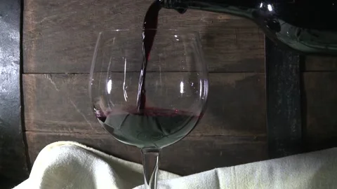 Pouring red wine in the wine cellar Stock Footage 146639635